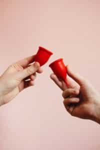 person-holding-menstrual-cup