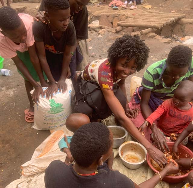 Agnes eating with the kids in Kampala