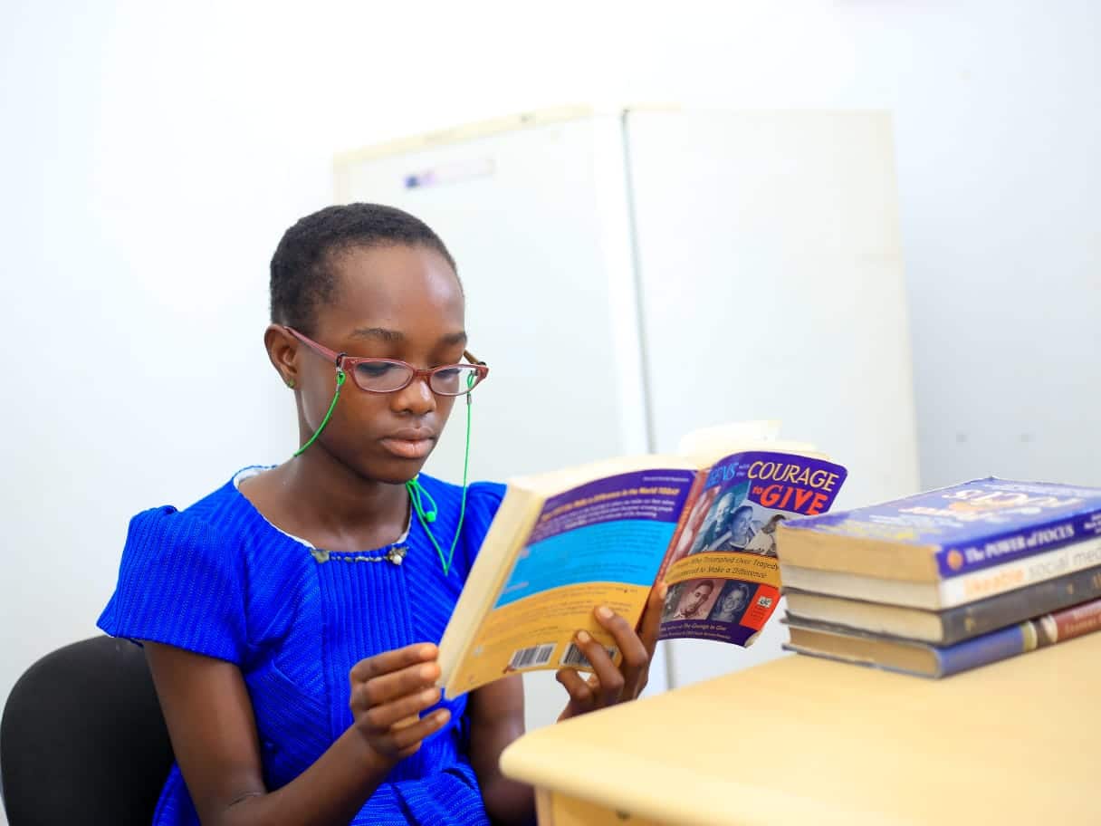 Joy reading a book - Education in Nigeria 