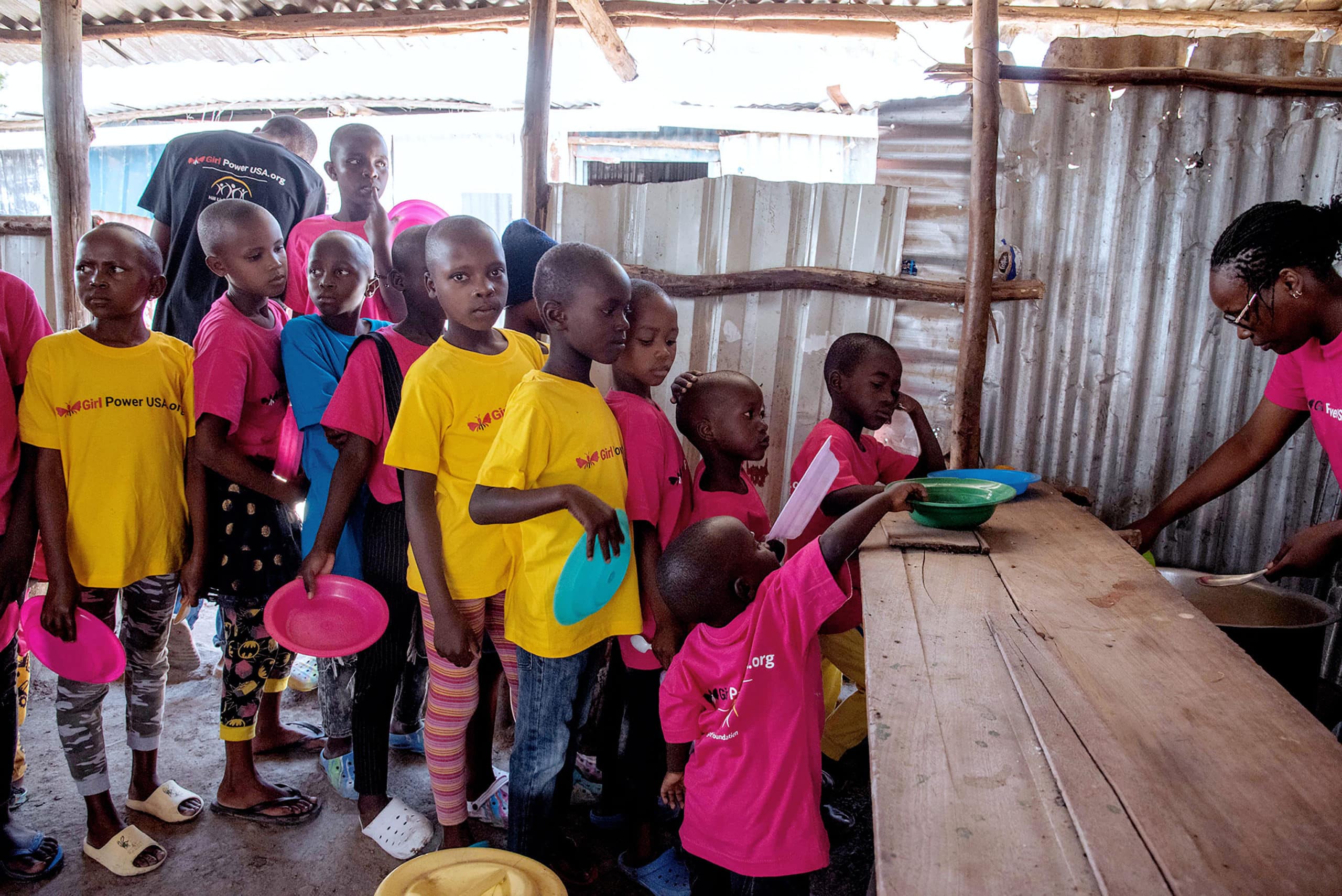  Children waiting in line to receive their servings of food - Solutions to Hunger in Africa 