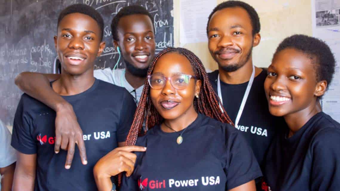 Team wearing Girl Power USA t-shirts in class.