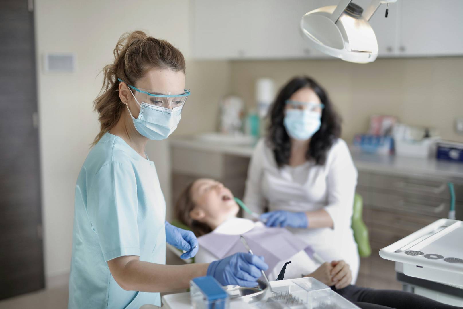 female-dentist-treating-her-patient